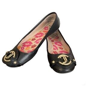 Juicy Couture black flats with gold toned emblem plate. Women’s size 9M